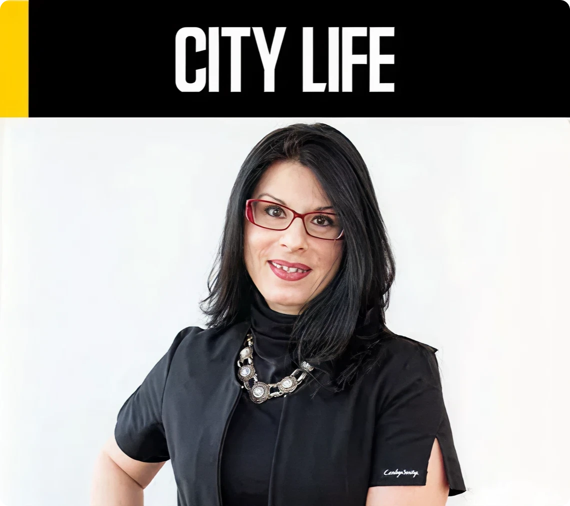 Woman smiling under "City Life" banner